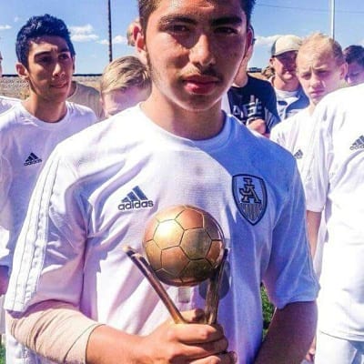 Adrian Calderon with soccer trophy
